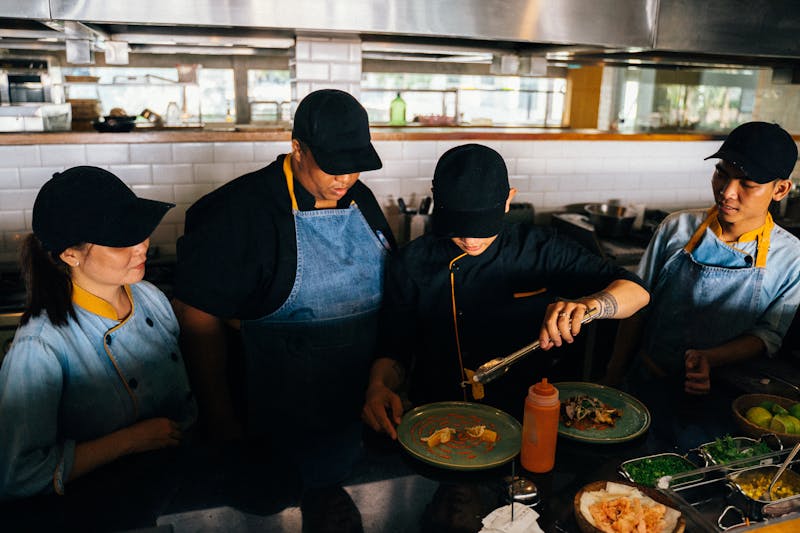 Cafe Rio open kitchen preparation area with team at work